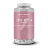 Transparante pot met witte capsules en een roze etiket met de tekst "Haar, huid & Nagels.