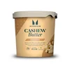 Een pot Myprotein cashewboter met een lichtbeige deksel en een beige etiket.