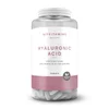 Doorzichtige pot met witte hyaluronzuurtabletten van Myvitamins, met een wit etiket.