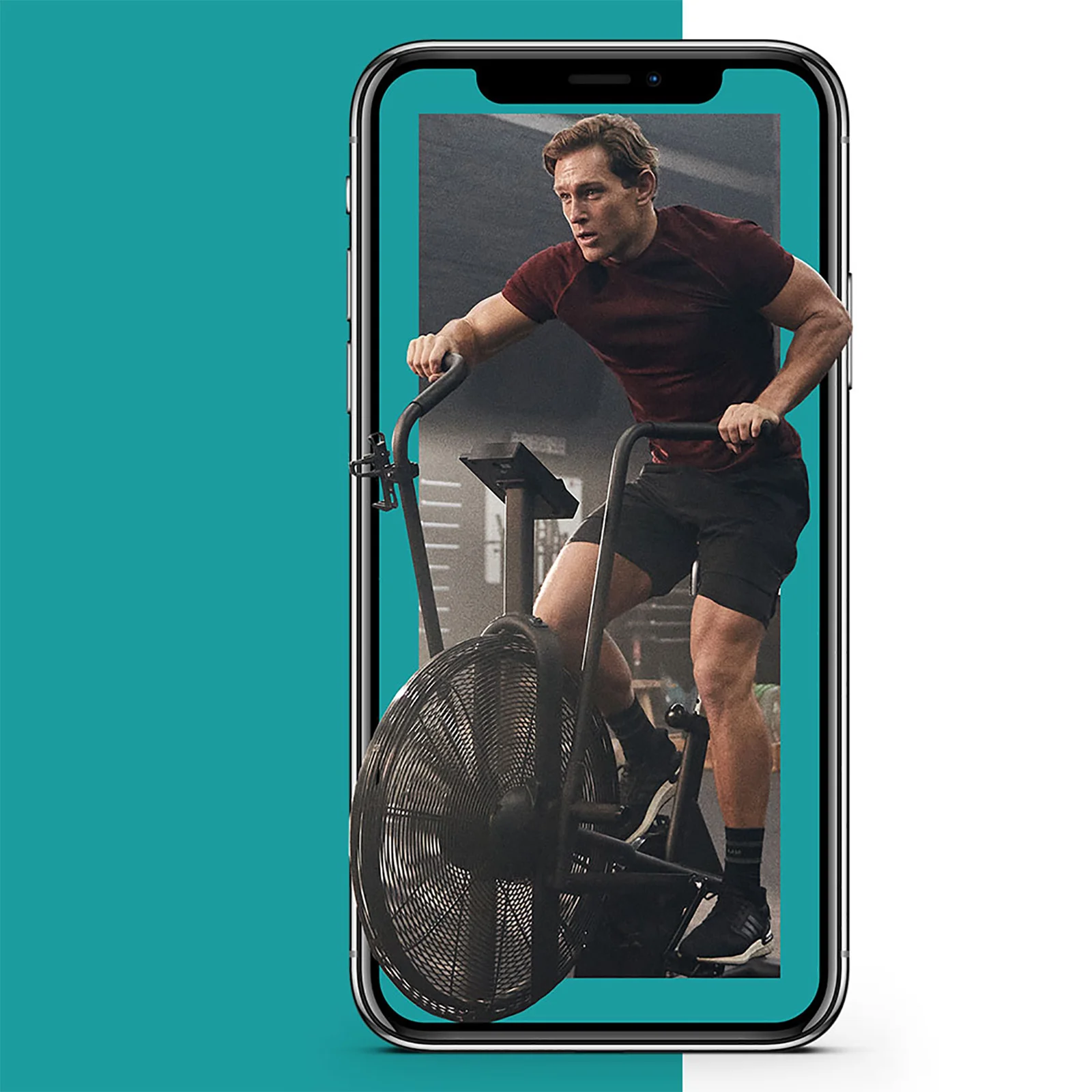Een smartphone toont een man op een hometrainer, tegen een turquoise achtergrond.