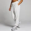 Een gemêleerd lichtgrijze joggingbroek van MP, met een elastische tailleband en zakken.