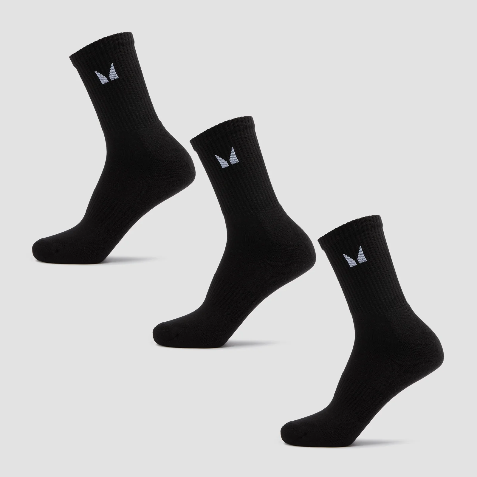 Drie zwarte sokken met een wit MP-logo, geribbeld en halfhoog.