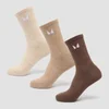 Drie paar sokken in neutrale kleuren: beige, lichtbruin en bruin, met een wit logo.