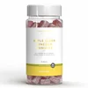 Een doorzichtige pot gevuld met rode, suikervrije gummies, met een wit etiket en een witte deksel.