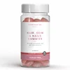 Een doorzichtige pot met roze, suikervrije gummies en een wit etiket.