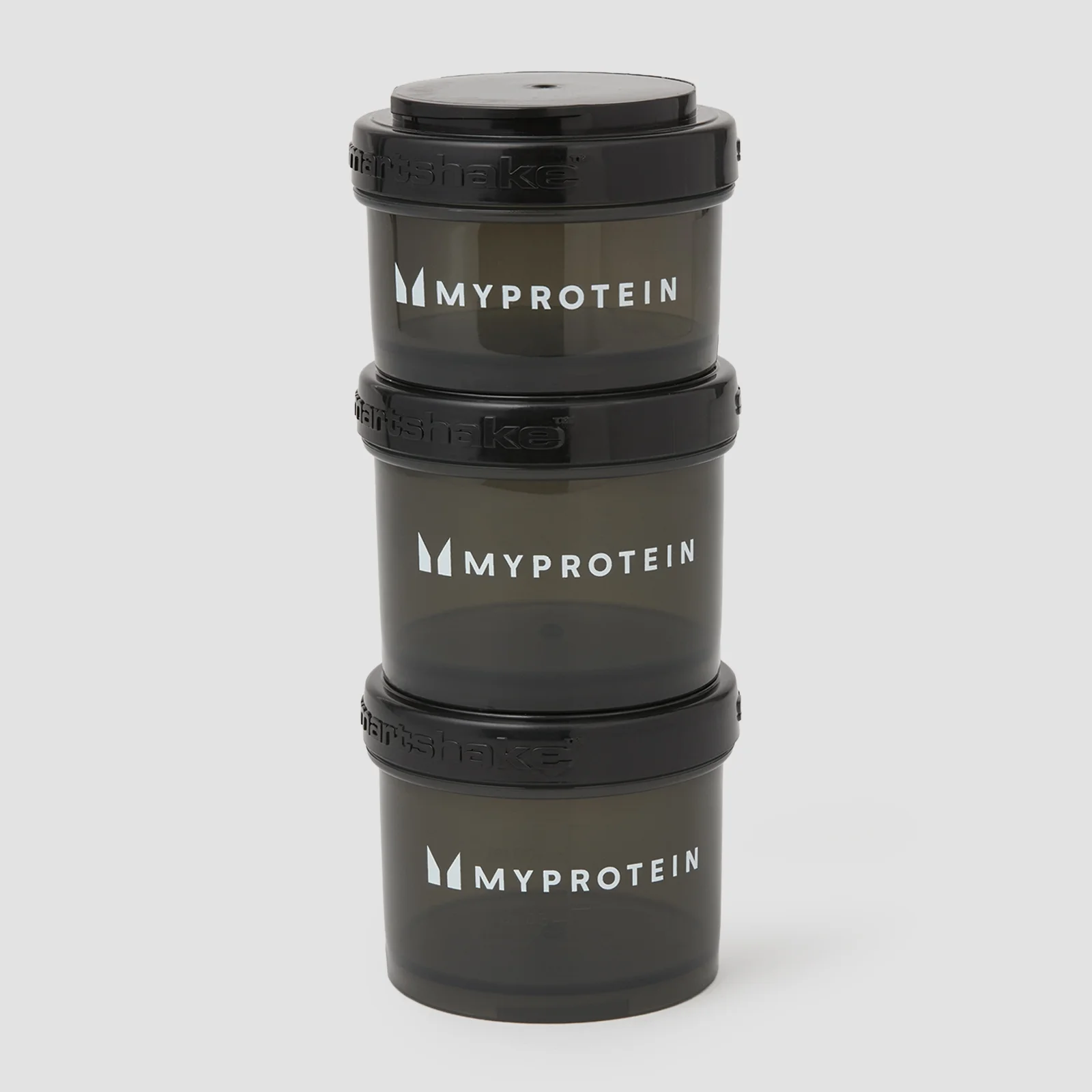 Zwarte Myprotein Power Tower: drie gestapelde, doorzichtige potjes met deksels en het Myprotein logo.